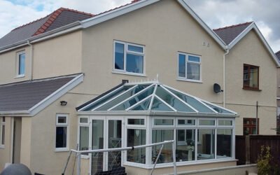 DOUBLE TWO-STOREY EXTENSION TO TWO HOUSES
