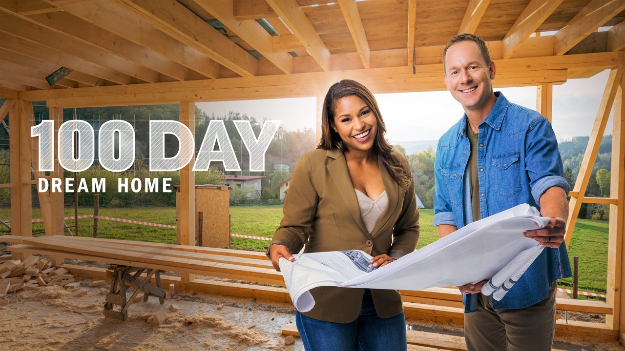 Exploring the best TV Design Programmes - Brian and Mika Kleinschmidt inside a timber frame under construction holding the plans between them